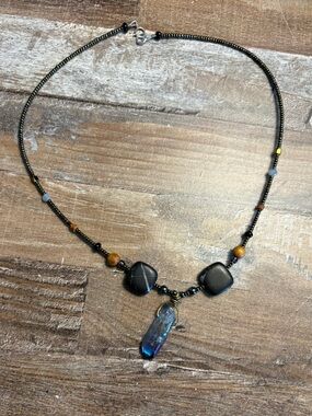 Black Bead Necklace with Blue Crystal Pendant